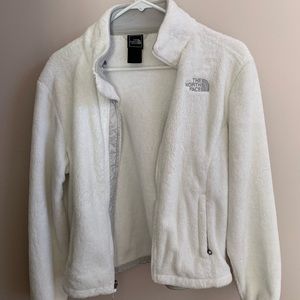 White fuzzy north face jacket